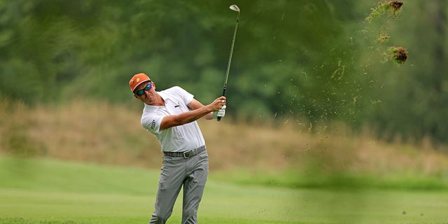 Rickie Fowler plays the second shot during the first round of the FedEx St. Jude Championship at TPC Southwind on August 11, 2022 in Memphis, Tennessee.