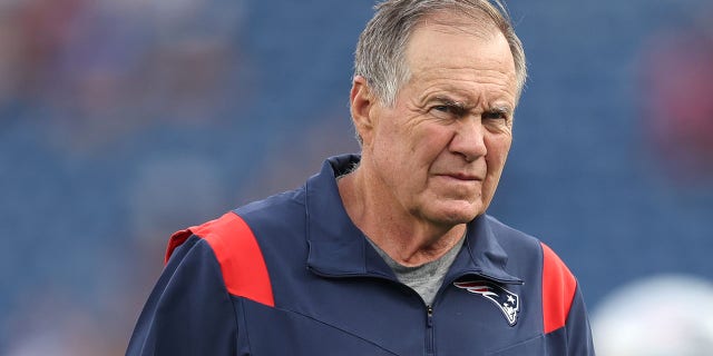Head coach Bill Belichick of the New England Patriots looks on ahead of the preseason game between the New York Giants and the New England Patriots at Gillette Stadium on August 11, 2022 in Foxborough, Massachusetts.