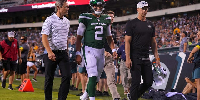 Zach Wilson (2) of the New York Jets walks to the locker room after injuring a knee against the Philadelphia Eagles in the first half of a game at Lincoln Financial Field Aug. 12, 2022, in Philadelphia. 