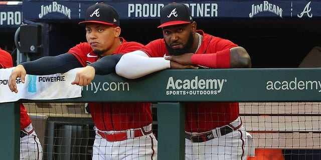Marcell Ozuna #20 and William Contreras #24 of the Atlanta Braves look on from the dugout during the first inning against the Houston Astros at Truist Park on August 19, 2022 in Atlanta, Georgia. 