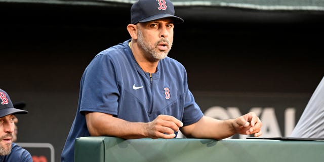 Alex Cora of the Boston Red Sox watches the game against the Orioles at Camden Yards on Aug. 20, 2022, in Baltimore.