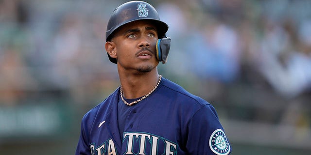 Julio Rodriguez of the Seattle Mariners walks back to the dugout against the Oakland Athletics at RingCentral Coliseum in Oakland, California, on Aug. 20, 2022.