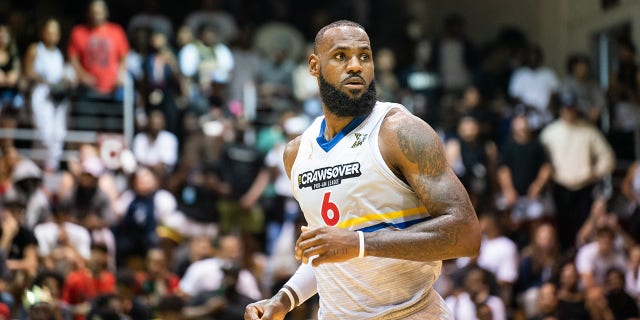 LeBron James runs down the court during the CrawsOver Pro-Am game at Seattle Pacific University on August 20, 2022 in Seattle.