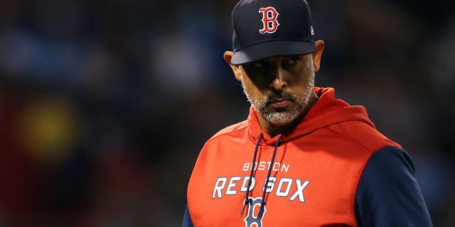 Boston Red Sox manager Alex Cora looks on during the third inning at Fenway Park on August 23, 2022 in Boston. 