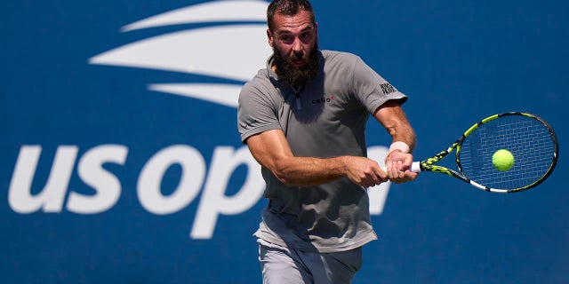 Benoit Paire of France plays a backhand against Cameron Norrie of Great Britain during the men's singles first round of the 2022 U.S. Open at USTA Billie Jean King National Tennis Center in New York on Aug. 30, 2022.