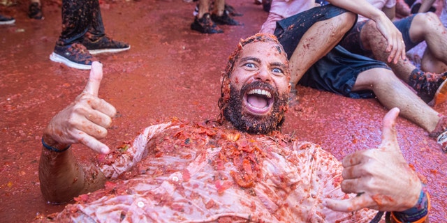 The world's largest food fight festival, La Tomatina, consists of throwing overripe and low-quality tomatoes at each other. (Zowy Voeten/Getty Images)