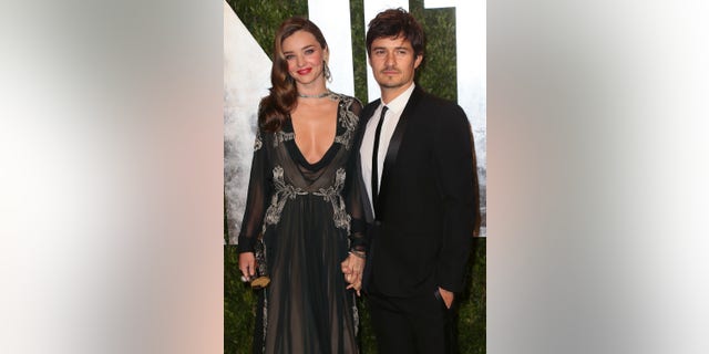 Miranda Kerr and Orlando Bloom (pictured in 2013) co-parent son Flynn together. Kerr has said she "adores" Katy Perry. 