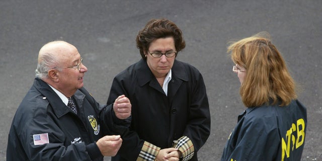 Staten Island Borough President James P. Molinaro, U.S. Department of Transportation Commissioner Iris Weinshall and National Transportation Safety Board chair Ellen G. Engleman meet after a deadly ferry crash on October 16, 2003, at St. George Staten Island Ferry terminal in Staten Island in New York City. 