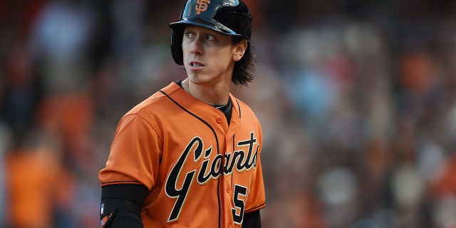 Tim Lincecum, #55 of the San Francisco Giants, looks back at the scoreboard as he walks back to the dugout in the bottom of the second inning against the Arizona Diamondbacks at AT&erio;T Park on July 11, 2014 en San Francisco.