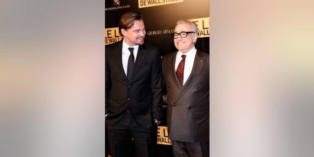 Leonardo DiCaprio and Martin Scorsese laugh at a photo call before "The Wolf of Wall Street" world premiere at Cinema Gaumont Opera in Paris, France.