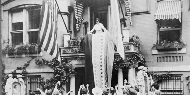 Alice Paul unfurls a banner from the balcony of the National Women's Party, showing a star for each state headquarters that ratified the 19th Amendment, giving women the right to vote.  The women Tennessee's ratification of the amendment in August 1920 — making the amendment law celebrated.