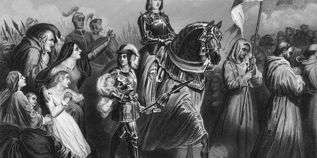 Roman Catholic saint Joan of Arc (1412 - 1431) entering Orléans, France, 1429. From an original engraving by W. Hulland after a painting by Henri Scheffer.