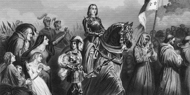 Roman Catholic saint Joan of Arc (1412 - 1431) entering Orléans, France, 1429. From an original engraving by W. Hulland after a painting by Henri Scheffer.