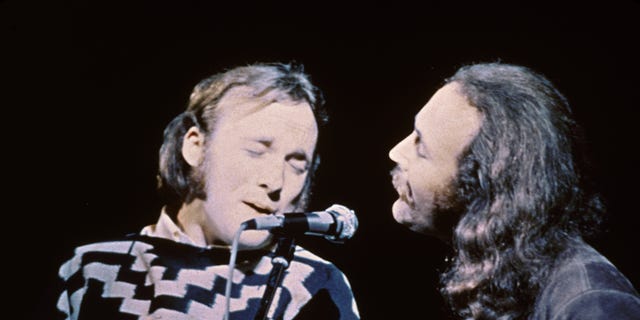 Stephen Stills (left) and David Crosby of the group Crosby, Stills &amp; Nash perform on stage at the Woodstock Music and Art Festival in Bethel, N.Y., in 1969.