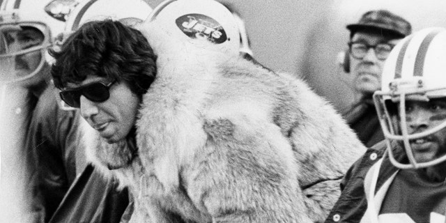 Joe Namath of the New York Jets wears his fur coat during a game against the New England Patriots on November 11, 1973 at Shea Stadium in New York.