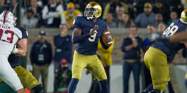 Fighting Irish quarterback Malik Zaire looks downfield against the Stanford Cardinals at Notre Dame Stadium in South Bend, Indiana.