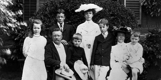 A portrait of Theodore Roosevelt (1858-1919) with his family in 1903, prior to his election to president in 1904. His oldest child Alice (in white hat, center) stands at the rear. 