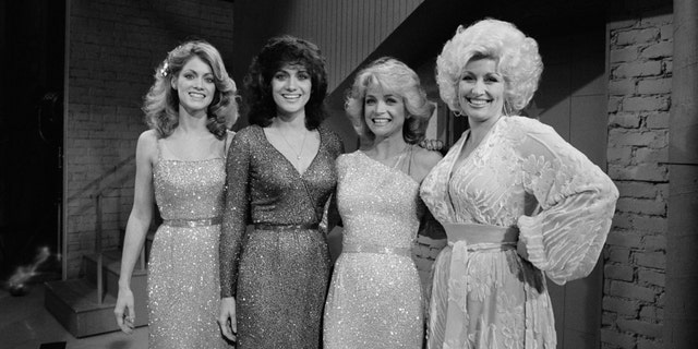 Dolly Parton, right, is pictured with the three Mandrell sisters.