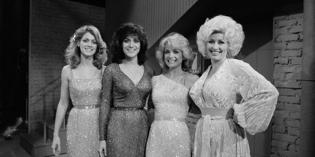 Dolly Parton, right, is pictured with the three Mandrell sisters.