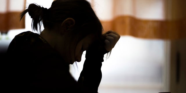 A girl struggles during a class at school on February 3, 2017. 