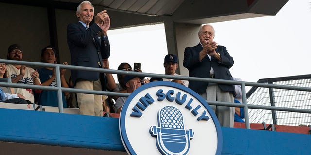Hall of Famer Sandy Koufax and former Dodger Manager Tom Lasorda unveil the Vin Scully plaque in the Dodgers' Ring of Honor before an MLB game between the San Francisco Giants and the Los Angeles Dodgers on May 3, 2017, at Dodger Stadium in Los Angeles, CA. 
