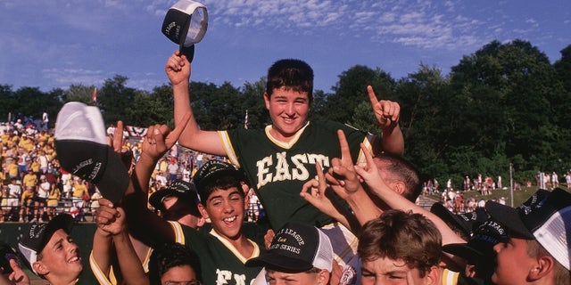 Little League World Series, East (Trumbull CT): Chris Drury is carried on the shoulders of his team after the winning game vs. Kaohsiung Taiwan in Williamsport, Penn., in August 1989. Drury is a member of the U.S. Hockey Hall of Fame and now general manager of the New York Rangers.