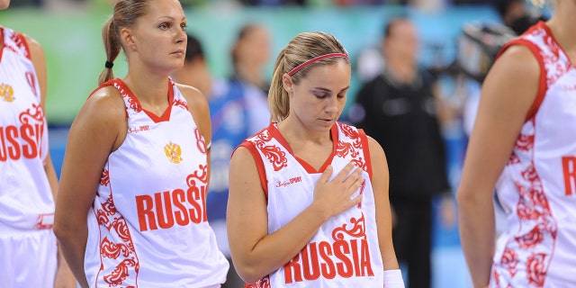 Becky Hammon of Russia stands for the national anthem prior to the game against the US Women's Senior National Team at the Olympic Games on Aug. 21, 2008 in Beijing.