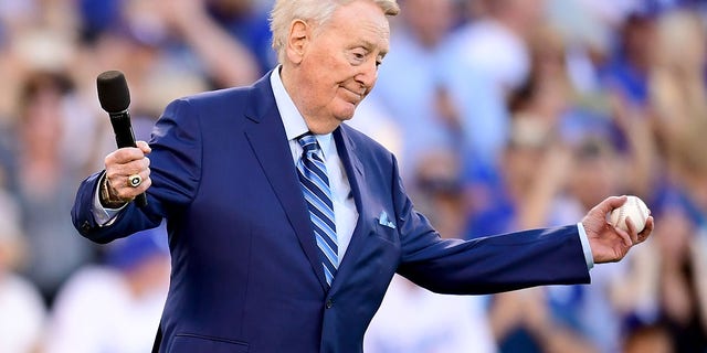 Former Los Angeles Dodgers broadcaster Vin Scully speaks to fans before Game 2 of the 2017 World Series between the Houston Astros and the Los Angeles Dodgers at Dodger Stadium on October 19, 2017. 25, 2017 , in Los Angeles, California.