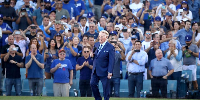 Former Los Angeles Dodgers broadcaster Vin Scully addresses fans before game two of the 2017 World Series between the Houston Astros and the Los Angeles Dodgers at Dodger Stadium on October 25, 2017 in Los Angeles.  