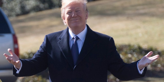 President Donald Trump and First Lady Melania Trump walk to Marine One upon prior to departure from the South Lawn of the White House in Washington, DC, February 5, 2018, as they travel to Ohio. 