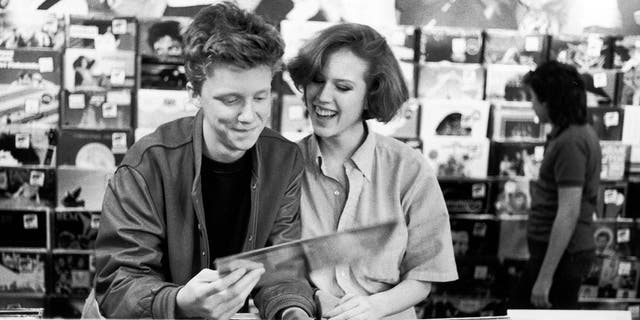Anthony Michael Hall and Molly Ringwald browsing at a record shop during a break filming ‘The Breakfast Club’.
