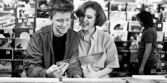 Anthony Michael Hall and Molly Ringwald browsing at a record shop during a break filming ‘The Breakfast Club’.