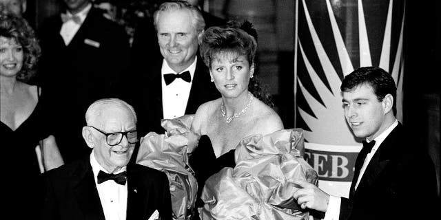 Sarah, Duchess of York, and her then-husband, Prince Andrew, are joined by American businessmen Armand Hammer, foreground, left, and Lodwrick Cook, rear, center, on Feb. 28, 1988, Los Angeles, California.