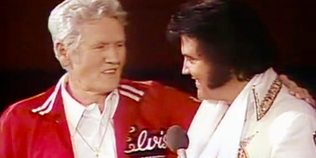 Vernon Presley (left) and Elvis Presley on stage during a concert recorded on June 19, 1977, in Omaha, Nebraska.