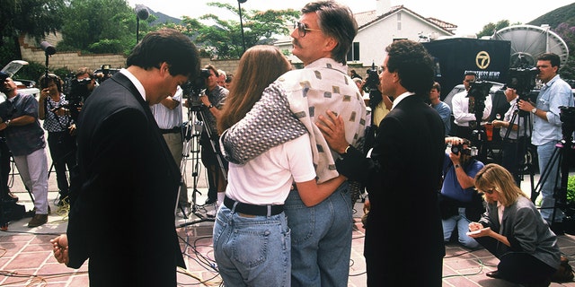 Kim and Fred Goldman, sister and father of Ronald Goldman, appear in front of the media on June 15, 1994, at their California home following the murders.