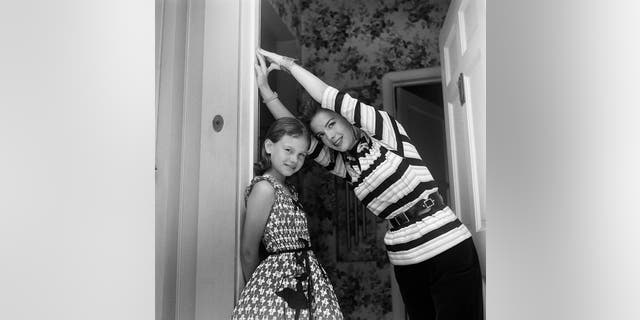 Actress Natalie Wood, right, and sister Lana Wood pose for a portrait at their home in Los Angeles. The elder sibling died in 1981 at age 43 from drowning.