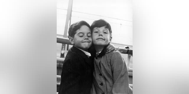 Lucie and Desi Jr., the children of Lucille Ball and Desi Arnaz, on board the liner 'SS Liberte' during a voyage to Europe, circa 1959.