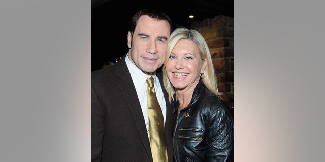 John Travolta and actress Olivia Newton-John attend the Qantas Airways Spirit of Australia Party at the Hollywood Roosevelt Hotel on January 12, 2012, in Hollywood, California. 