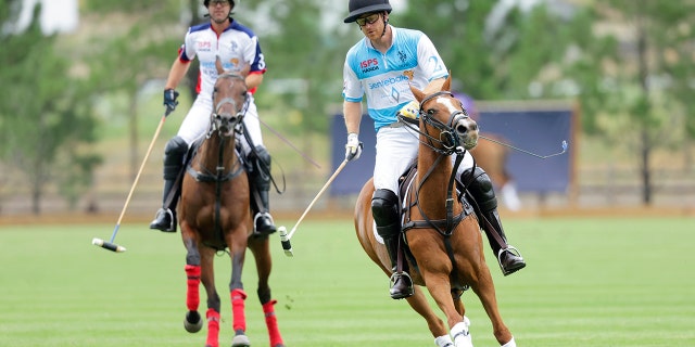 Gonzalo Pieres, left, and Prince Harry, Duke of Sussex, play polo during the Sentebale ISPS Handa Polo Cup 2022 in Aspen, Colorado.