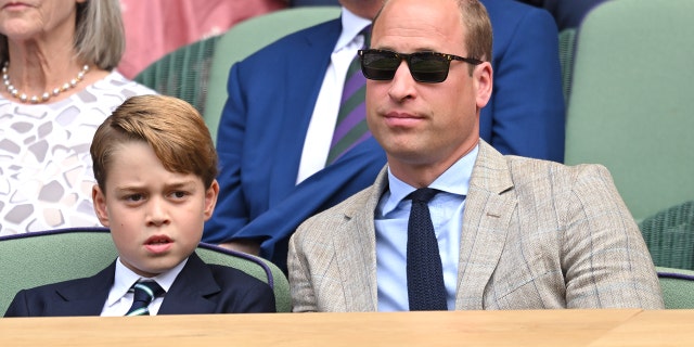 Prince George, seen here with his father Prince William, is third in line to the British throne.