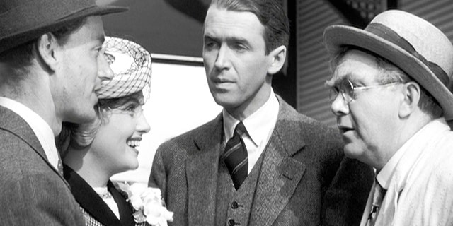 In a scene from "It's a Wonderful Life," Ruth Dakin Bailey (Virginia Patton) is introduced to her new in-laws, George Bailey (Jimmy Stewart) and Uncle Billy Bailey (Thomas Mitchell) by her husband Harry Bailey (Todd Karns).