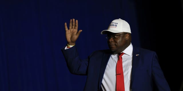 Candidate for Michigan's 3rd Congressional district John Gibbs waves to the crowd as he comes on stage during a rally held by former U.S. President Donald Trump in Washington Township, Michigan, U.S. April 2, 2022.