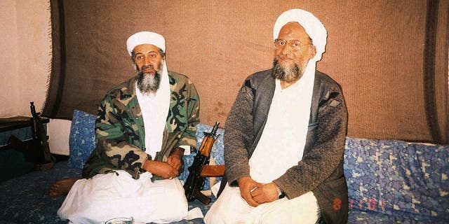 Usama bin Laden and al Qaeda leader Ayman Al Zawahri sitting side-by-side.