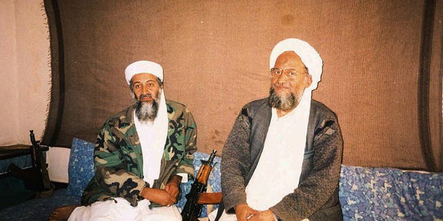 Usama bin Laden and al Qaeda leader Ayman Al Zawahri sitting side by side