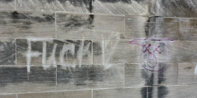 Remnants of graffiti of a dead pig on a Kenosha building with the slang andquot;F*** 12andquot;  meaning andquot;f***andquot; cops. (Photo courtesy of Rep. Bryan Steil's campaign.)