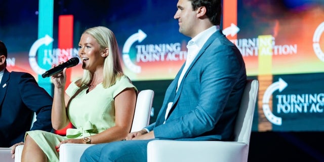 Karoline Leavitt has been endorsed by Turning Point USA founder and President Charlie Kirk, right.