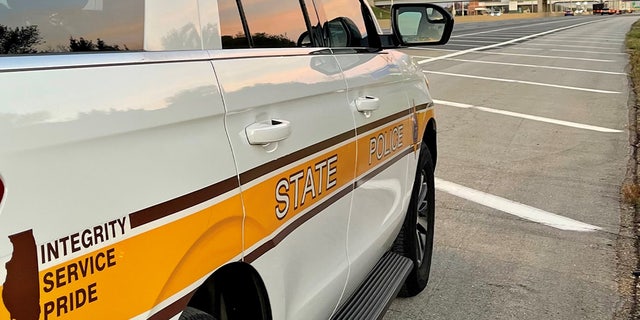 FILE- An Illinois State Police SUV is parked in a parking lot.