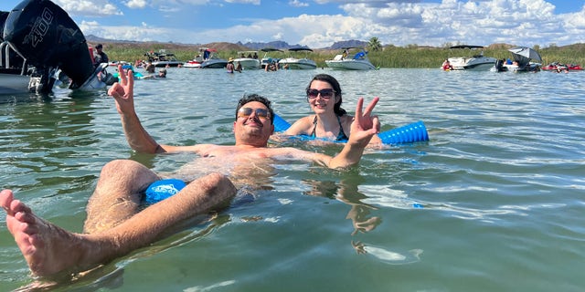 Crimean couple Ilias and Yana hang out at the lake with their new family.