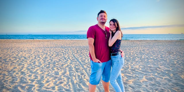 Crimean couple Ilias and Yana at the beach after fleeing from Crimea to California.