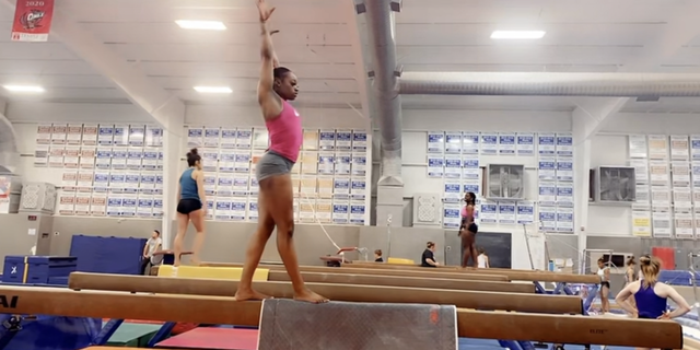 Fisk University gymnast Zyia Coleman sticks the landing while practicing skills on the balance beam.